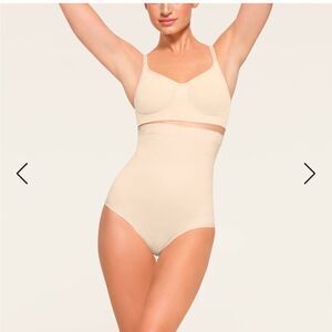 SKIMS NWT core control high waisted brief size small in the color sand